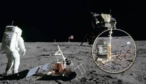 Historic shot from NASA showing some of W.L. Gore's cables in use on a moon landing. An astronaut on the moon's surface is facing towards the landing module.