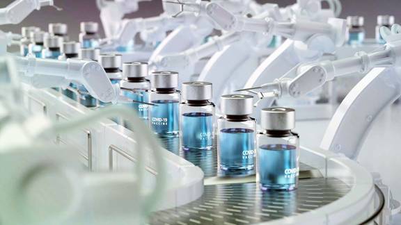 Covid 19 vaccine bottles on production line