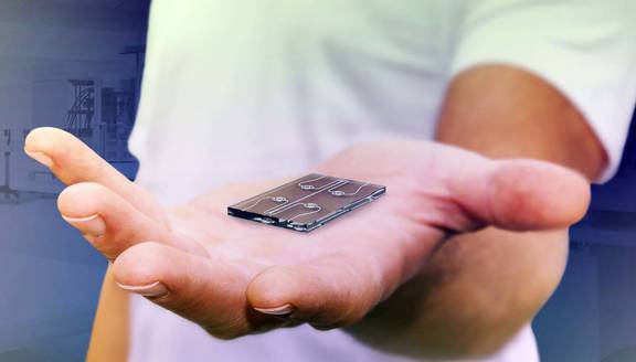 Man holding a Rab Microfluidics lab-on-a-chip-technology