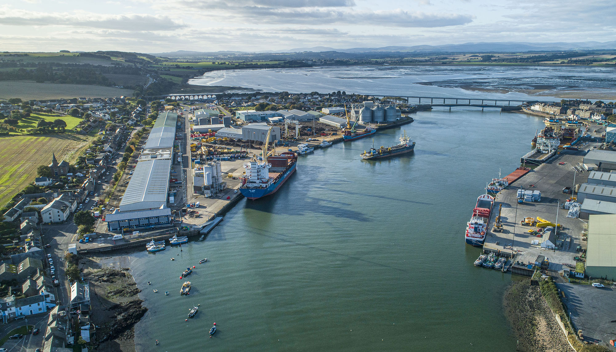 Aerial view of Montrose Port development showing harbour, ships, bridge and buildings infrastructure