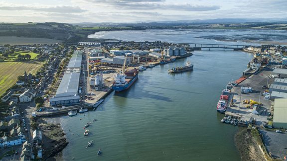 Aerial view of Montrose Port development showing harbour, ships, bridge and buildings infrastructure