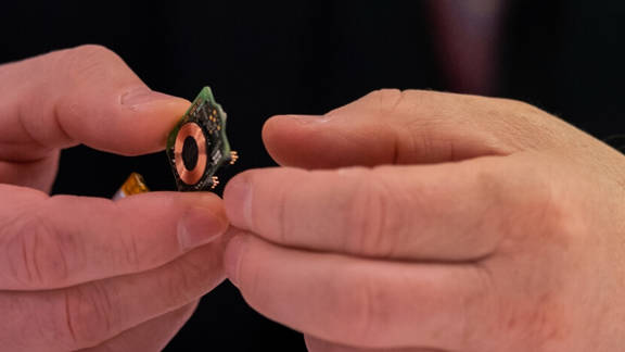 Man holding Enmovi's Motionsense technology
