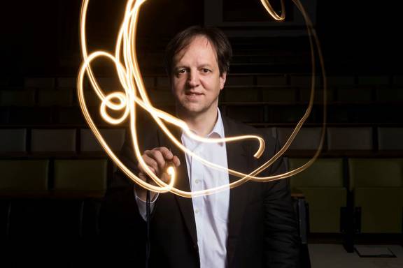 Professor Harald Haas, pureLiFi co-founder, making a 'light painting' by swirling a torch around his face
