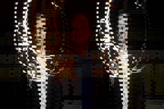 Professor Harald Haas, pureLiFi co-founder, making a 'light painting' by swirling a torch around his face